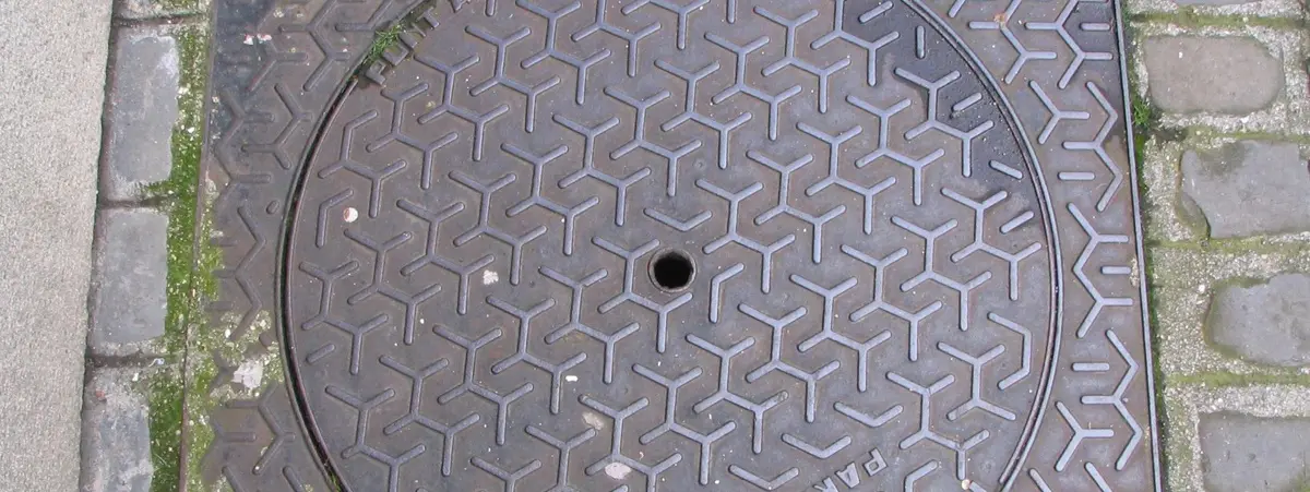 A close up of the floor with a hole in it
